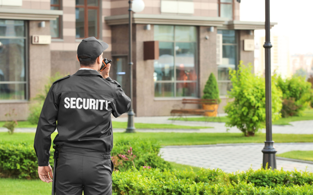 Guard looking over commercial building